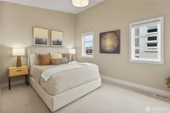 Third bedroom with custom closet organizer.