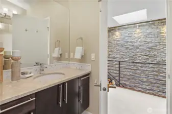 Main bath with dual vanities.