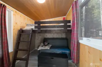 Bunk and futon and additional storage space in the sleeping cabin