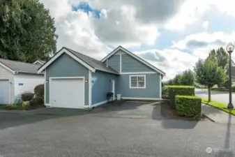 Back entrance with 1-car garage