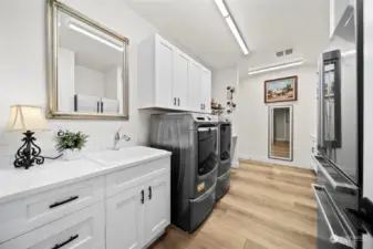 Large utility/laundry space with upgraded custom cabinetry