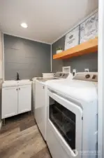 Remodeled lower level laundry room. All appliances stay.