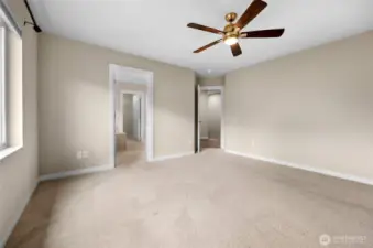 Primary bedroom looking at bathroom entrance and door to hallway!