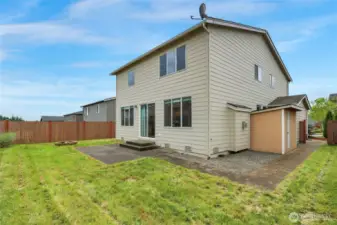 Fully fenced yard with a shed for lawn stuff, games, toys!