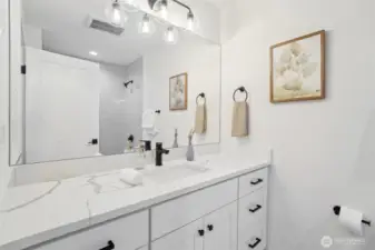 Photos of staged unit, 20313A. Level 3 common bath
