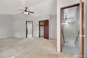 Upstairs is the primary bedroom! spacious with vaulted ceilings, on suite and small walk in closet.