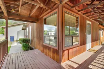 wrap around front deck!! whats not to love!?  Connecting to the backyard!