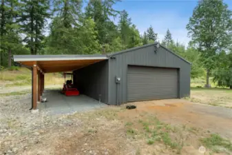 ChatGPT said:  Oversized detached two-car garage featuring a separate 220-amp meter—perfect for workshops or heavy-duty tools. Includes additional covered parking ideal for equipment, recreational vehicles, or extra storage.