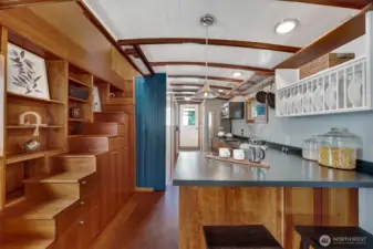 Room for a small dining room, but also this pennisula is a great way to enjoy the eat-in kitchen.