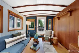 The living room has a functional Murphy bed option (pictured here on the right) for guests staying over.