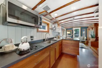 There is not an oven.  Propane cook top pictured and the microwave works as a convection oven.