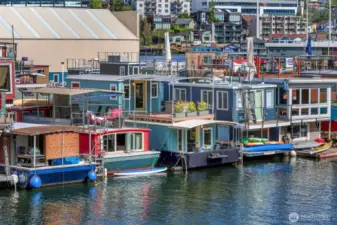 You can tie up a canoe/kayak like you see the other houseboats have done.  15% overhang is the general rule.