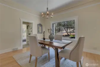 True to 1922 era, textured plaster walls & significant crown molding. Looking onto hallway bookshelf and main floor bedroom.