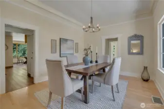 Dining looking into kitchen & breakfast nook. Doorway to right leads to bedroom, bath, stairway to upstairs.