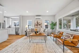 Seamless open floor plan with tons of natural light bursting into living and kitchen.