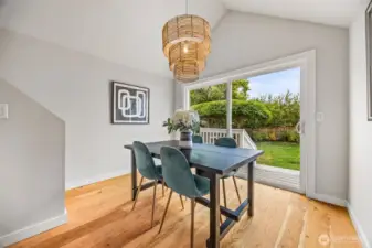 Soaring vaulted dining room ceiling provides a light and airy space which leads to beautiful backyard with custom pizza oven and spacious deck.