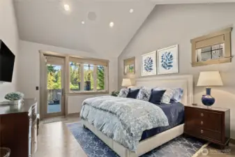 Primary Bedroom with door to outdoor patio and hot tub area