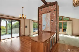 Another view of dining room with slider going to the large deck. Floors are Canary hardwood, beautiful!!