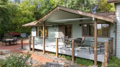 Back deck & cover has been updated. The spacious patio is just off to the side and fire pit is also on that side. All furniture stays with home.