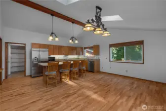 Kitchen and dining area. Pantry to left of fridge.