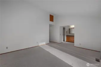 Primary bedroom w/ vaulted ceilings.