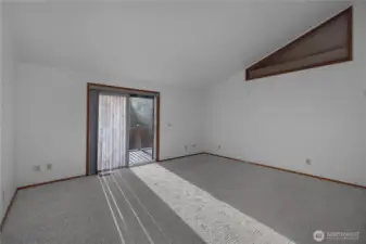 Primary bedroom- walk out the slider onto the huge, wraparound deck.