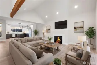 Open floor plan makes it easy to entertain guests. Lots of windows for natural light, tall vaulted ceilings, natural electric fireplace incased in quartz as the focal point of the living room. Natural stained exposed wood beam. (Staged).