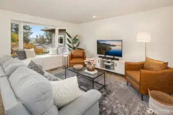 Living Room with a cute bump out garden window.