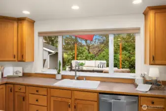 A big and bright window fills the kitchen with natural light.