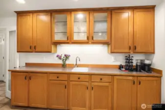Built-in buffet/butler's pantry provides even more counter space and storage. The additional sink makes it a super versatile space.