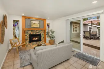 The family room off of the kitchen has sliding door access to the composite deck in the backyard.
