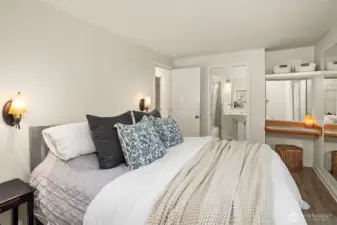 Primary bedroom with ensuite bathroom and built-in vanity.