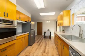 Kitchen is open and well lit