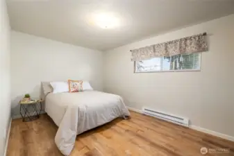 Primary bedroom, all baseboard heaters are new.