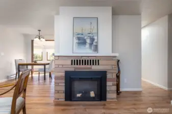 Fireplace, with electric insert. Exterior chimney was capped and removed.