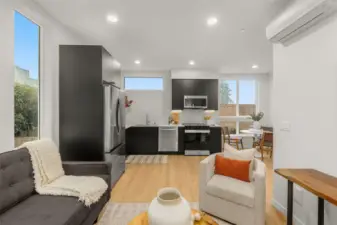 Panoramic windows flood the kitchen with natural light while highlighting designer finishes.