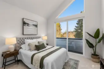 Top-floor bedroom with vaulted ceilings and plenty of space for rest and recharge.