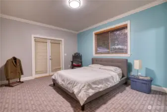 Primary Bedroom with French Doors leading to outside deck.