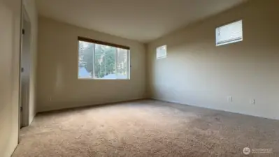 Primary bedroom; bathroom to the left