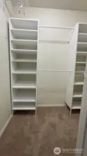 Primary bedroom walk in closet