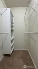 Primary bedroom walk in closet