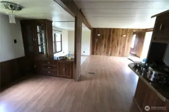 Dining room includes a built-in hutch, perfect for display and extra storage.