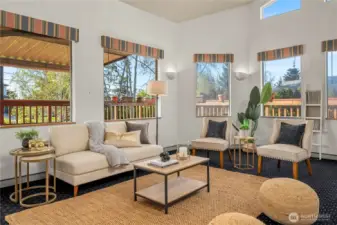 This sunken living room offers a spacious gathering place as part of the great room design.