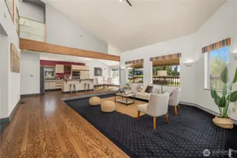 This view shows the spacious great room complete with living room, kitchen and eating area.