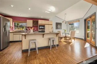 Beautiful hardwood floors offer easy maintenance for the kitchen, eating area and walkways.