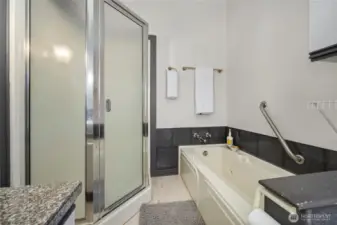 The primary bath has a separate shower and a jetted soaking tub.