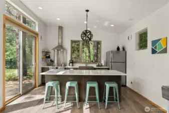 Contemporary kitchen with quartz counters, stainless appliances, and soft-close cabinetry.