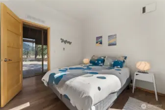 Step directly from your kitchen to a private deck surrounded by pine forest.
