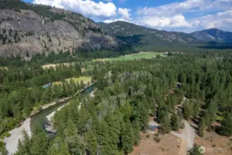 Aerial view of Mazama Meadows community showing riverfront, open space, and trail corridor.