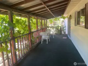 Covered porch and deck attached to the home